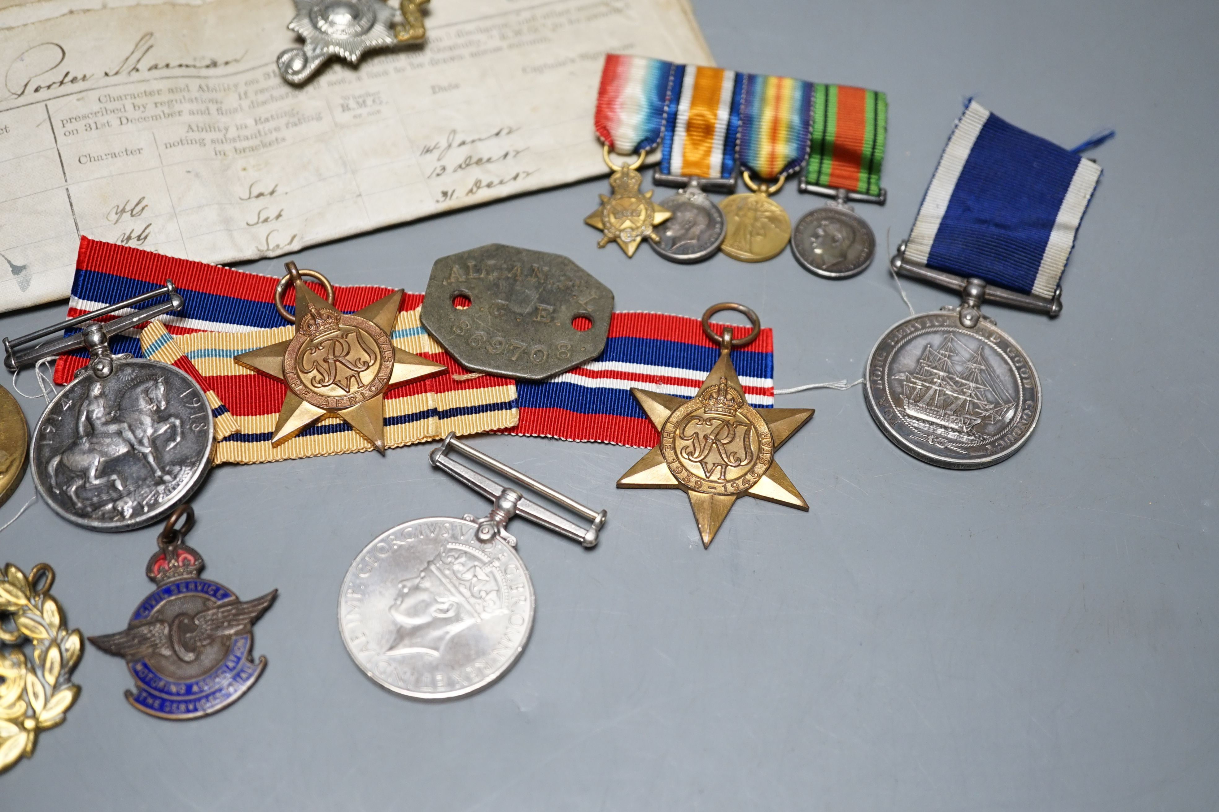 A WWI medal trio awarded to J. 11048 F. P. SHARMAN. A.B. R.N., a George V Royal Navy long service and good conduct medal awarded to M.38014 F. P. SHARMAN. R. P O. H.M.S. REPULSE, a WWI miniature dress medal group, a WWII